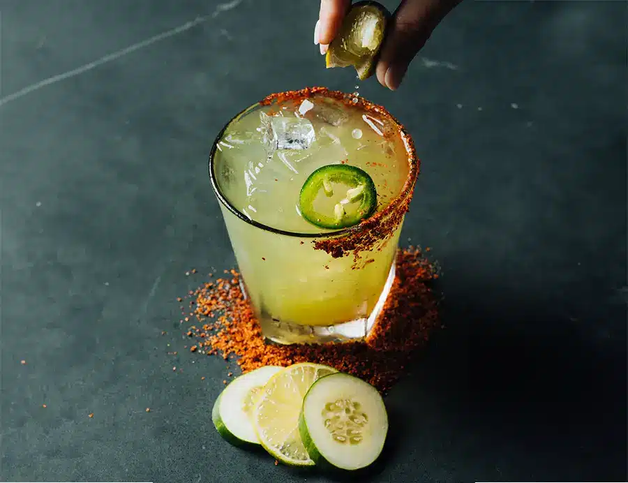 Craft cocktail garnished with lime