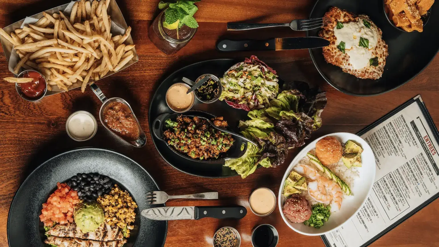 Overhead view of a table full of Tap 42 dishes